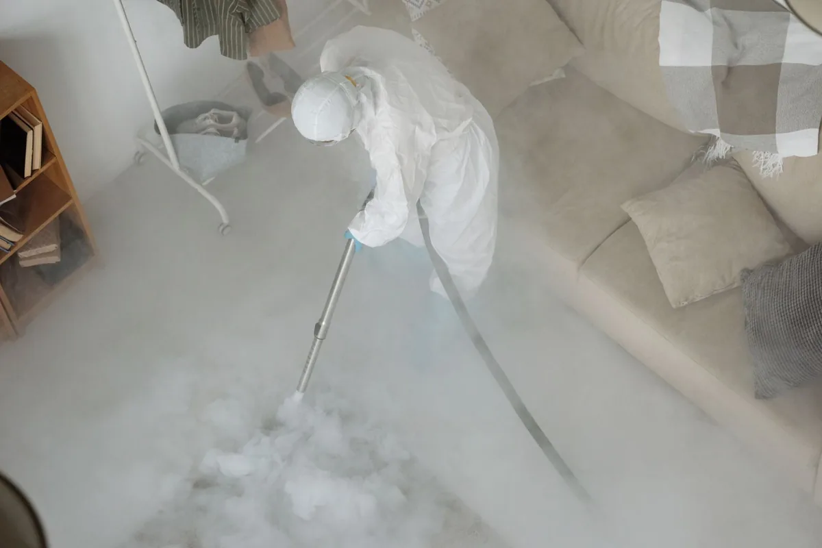 Biohazard cleanup technician in protective equipment, Big Timber, MT